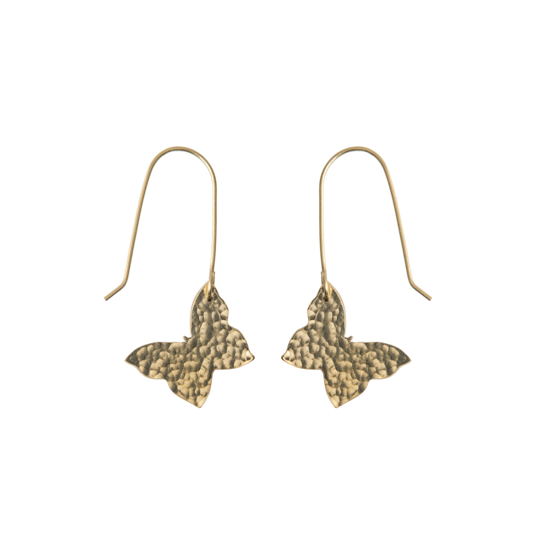 A pair of dangling brass earrings in the shape of butterflies.